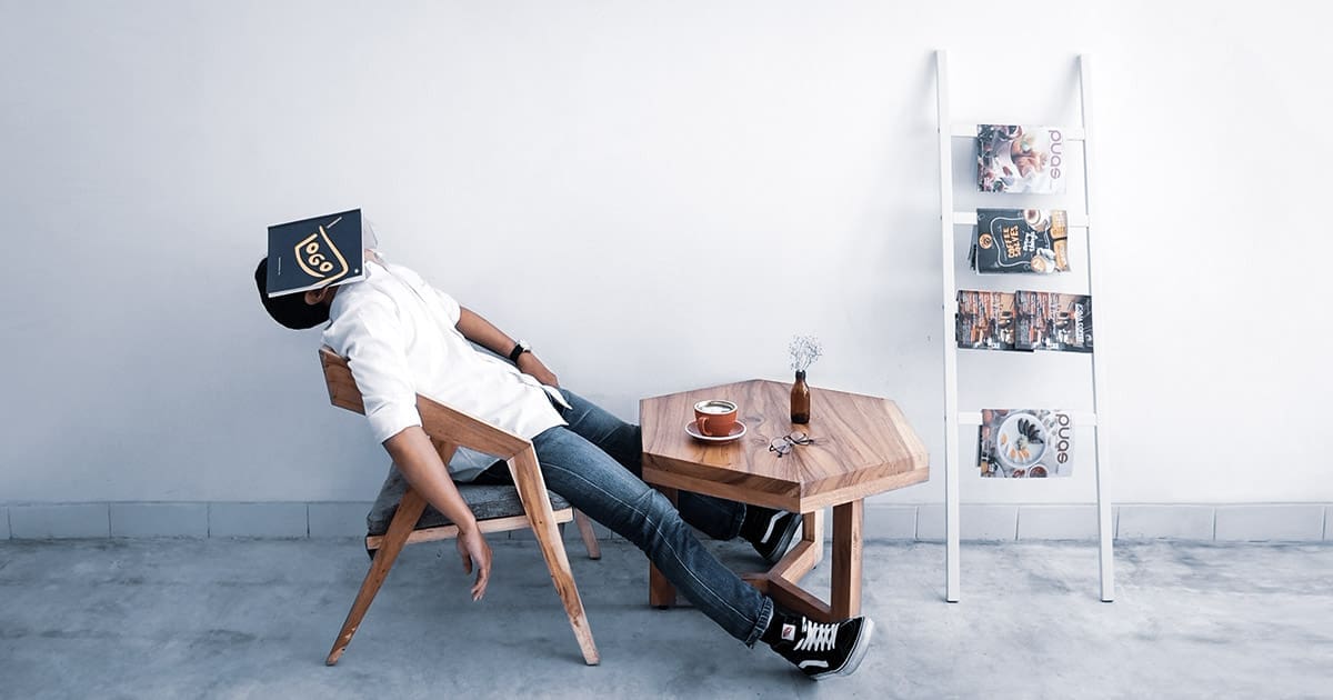 man sleeping chair